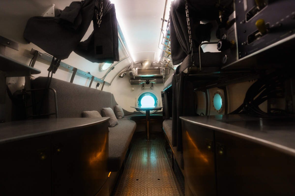 Vanguard is equipped with a seating area with a window, in addition to bunks and a kitchen.